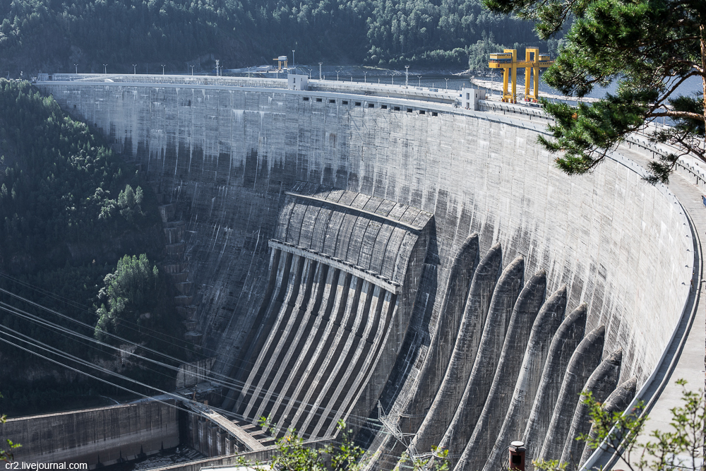 The station includes the 242 meter high dam, a power plant building and an additional spillway locat...